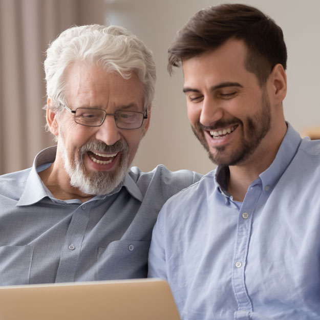 Two men looking at tablet